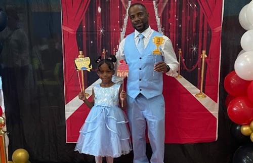 father and daughter posing with prompts